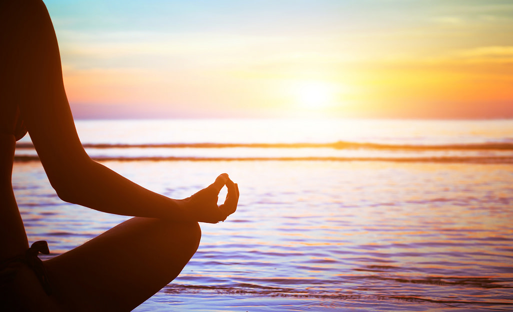 meditating at sunset meditating at sunset