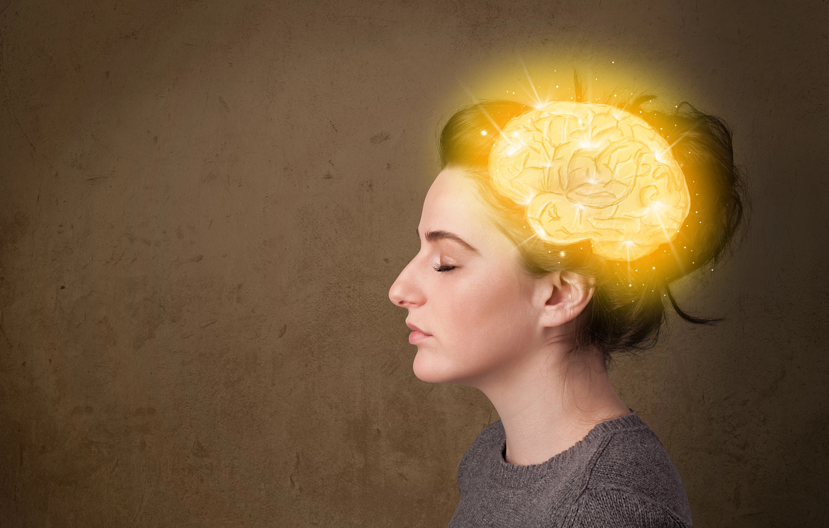 girl using postiive thoughts and affirmations with glowing brain