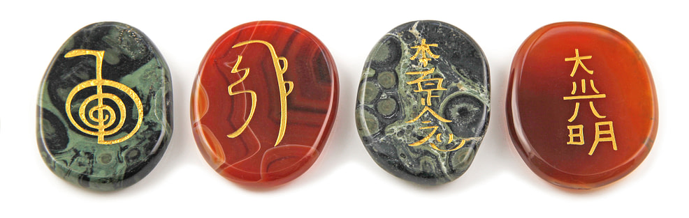 Four major Usui Reiki symbols etched in stone