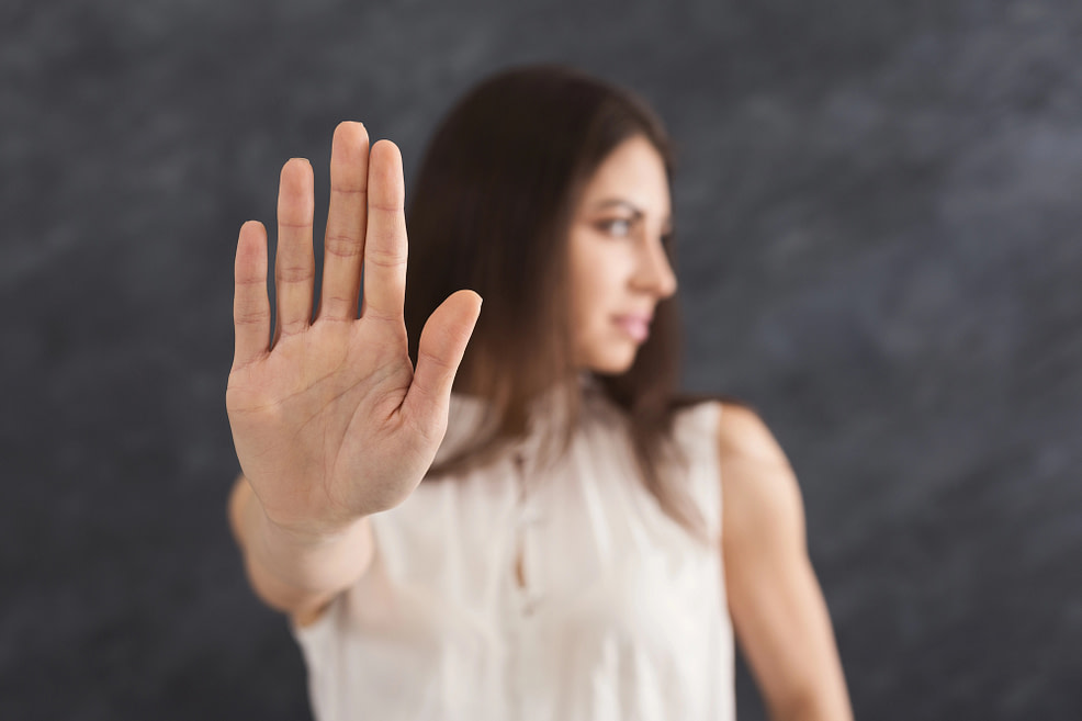 woman holding out hand woman holding out hand-avoiding true feelings and beliefs
