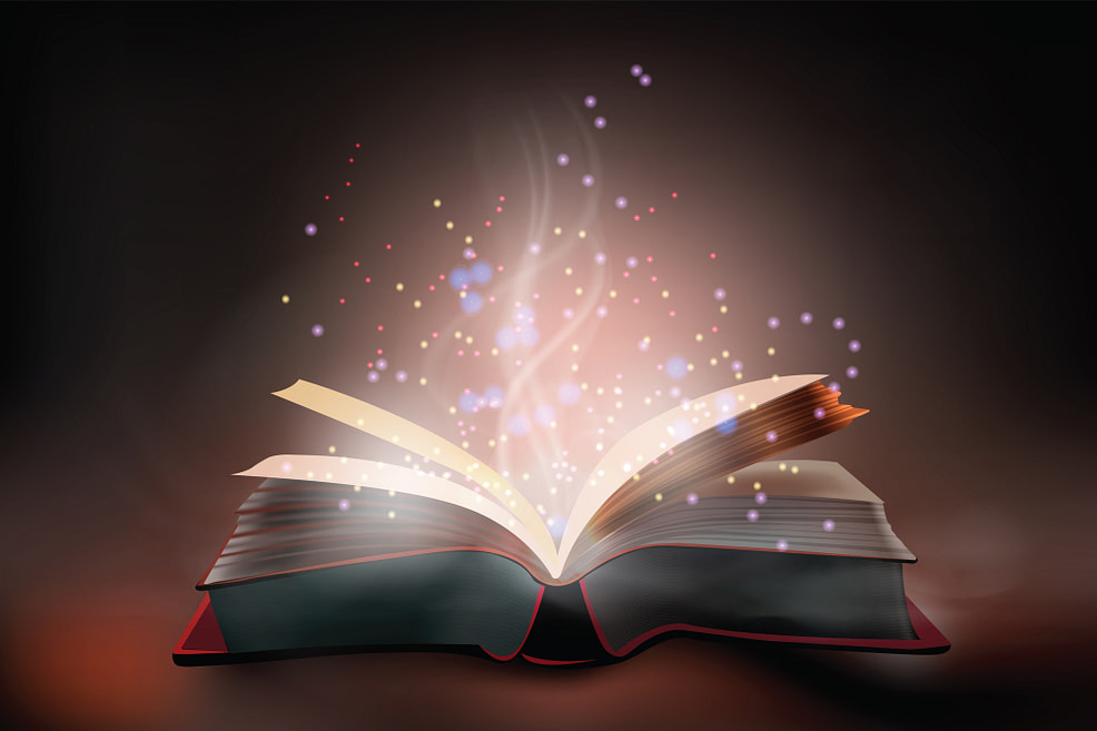 Magic book with life’s answers Magic book open and lit up