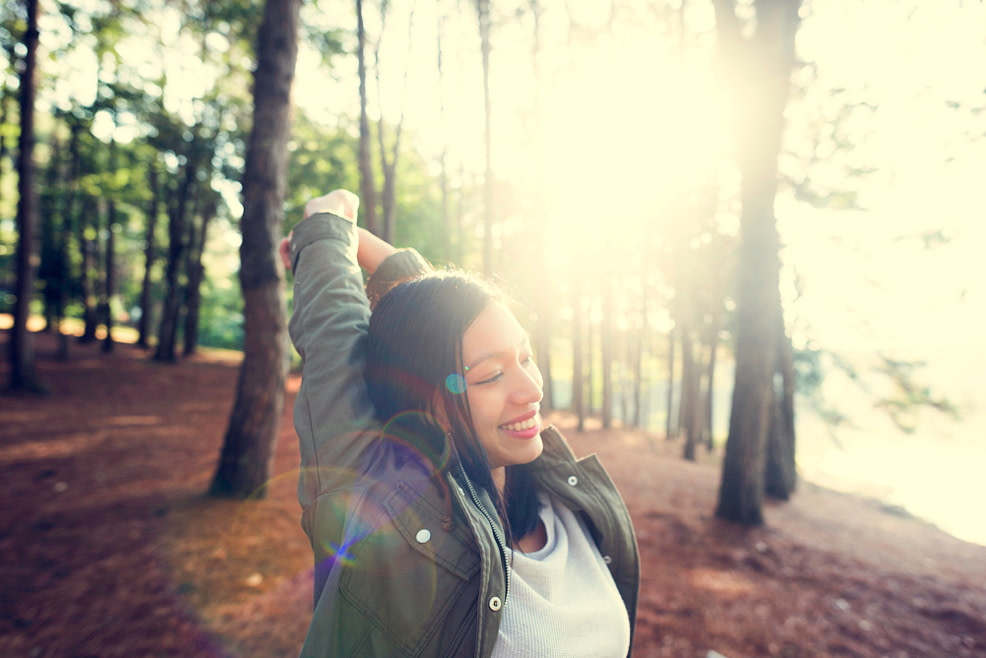 Woman feeling empowered Woman in the forest feeling empowered