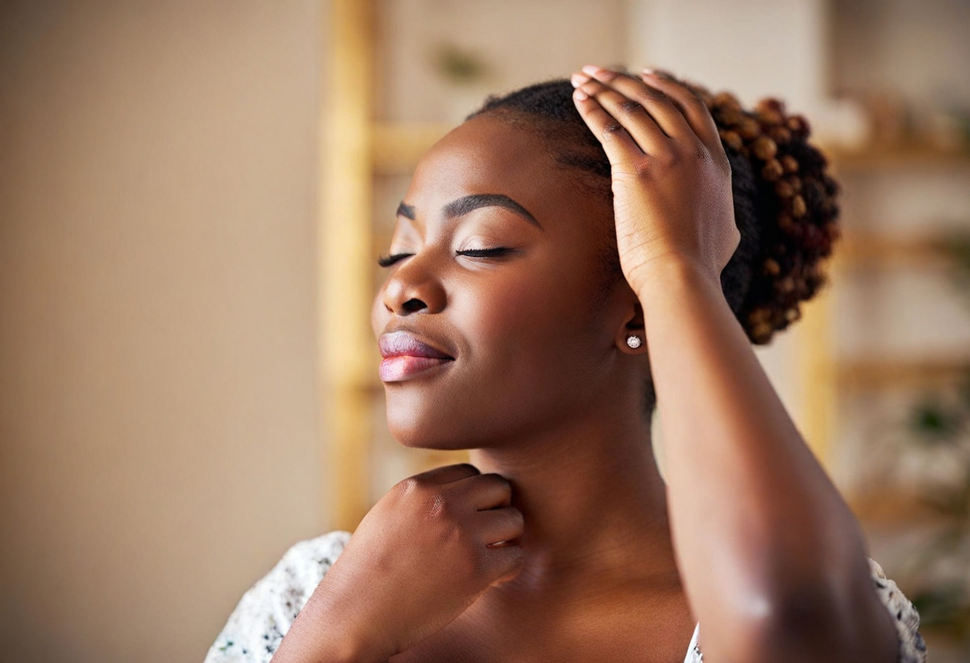 self-Reiki: Woman with one hand placed on her head and one on her throat