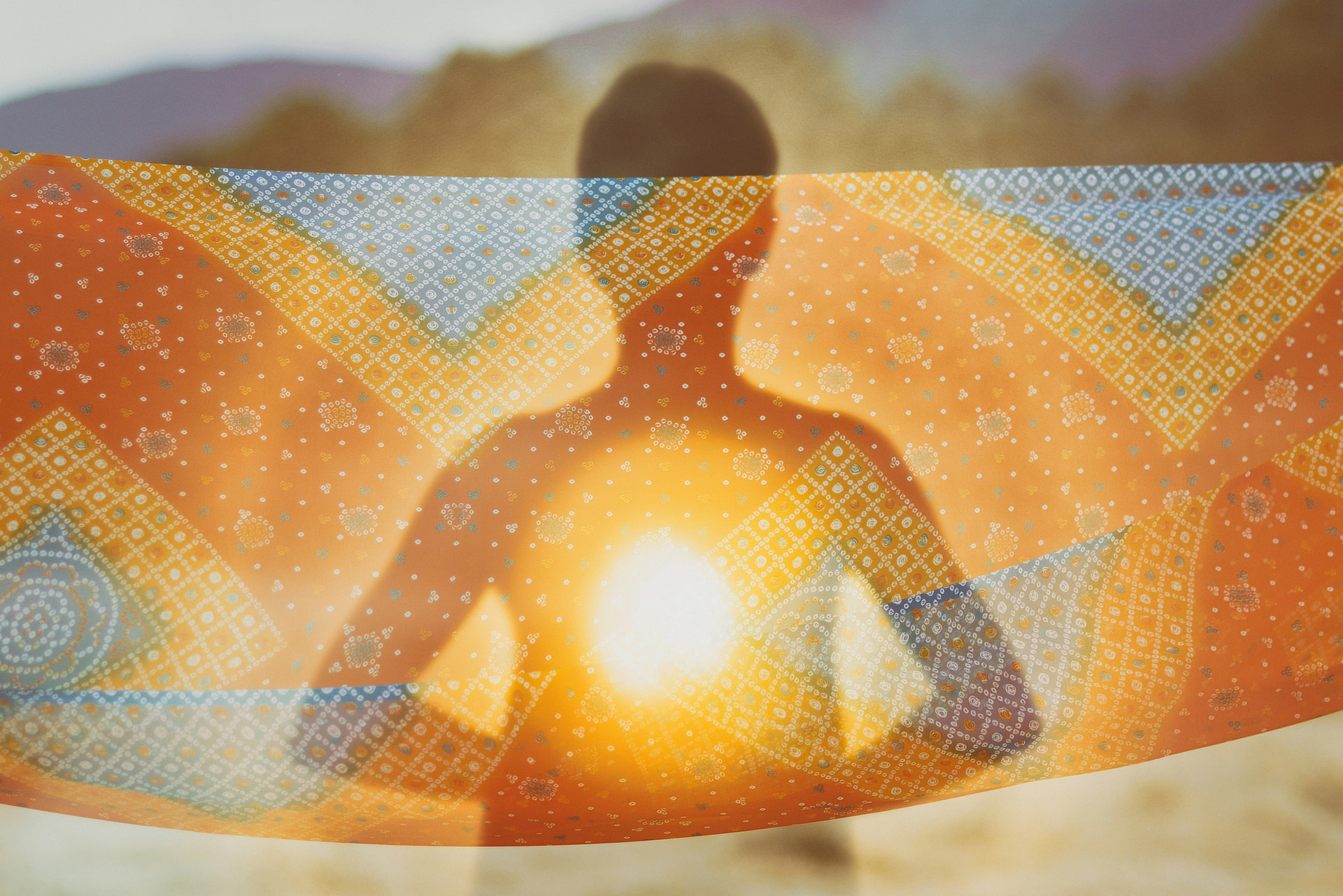 silhouette with spiritual light radiating from chest