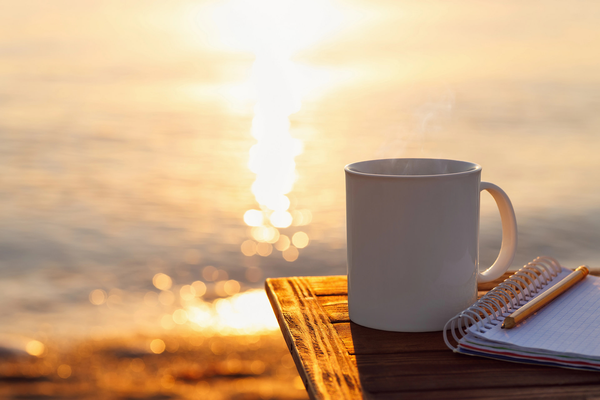 Mug on a coffee table by the water